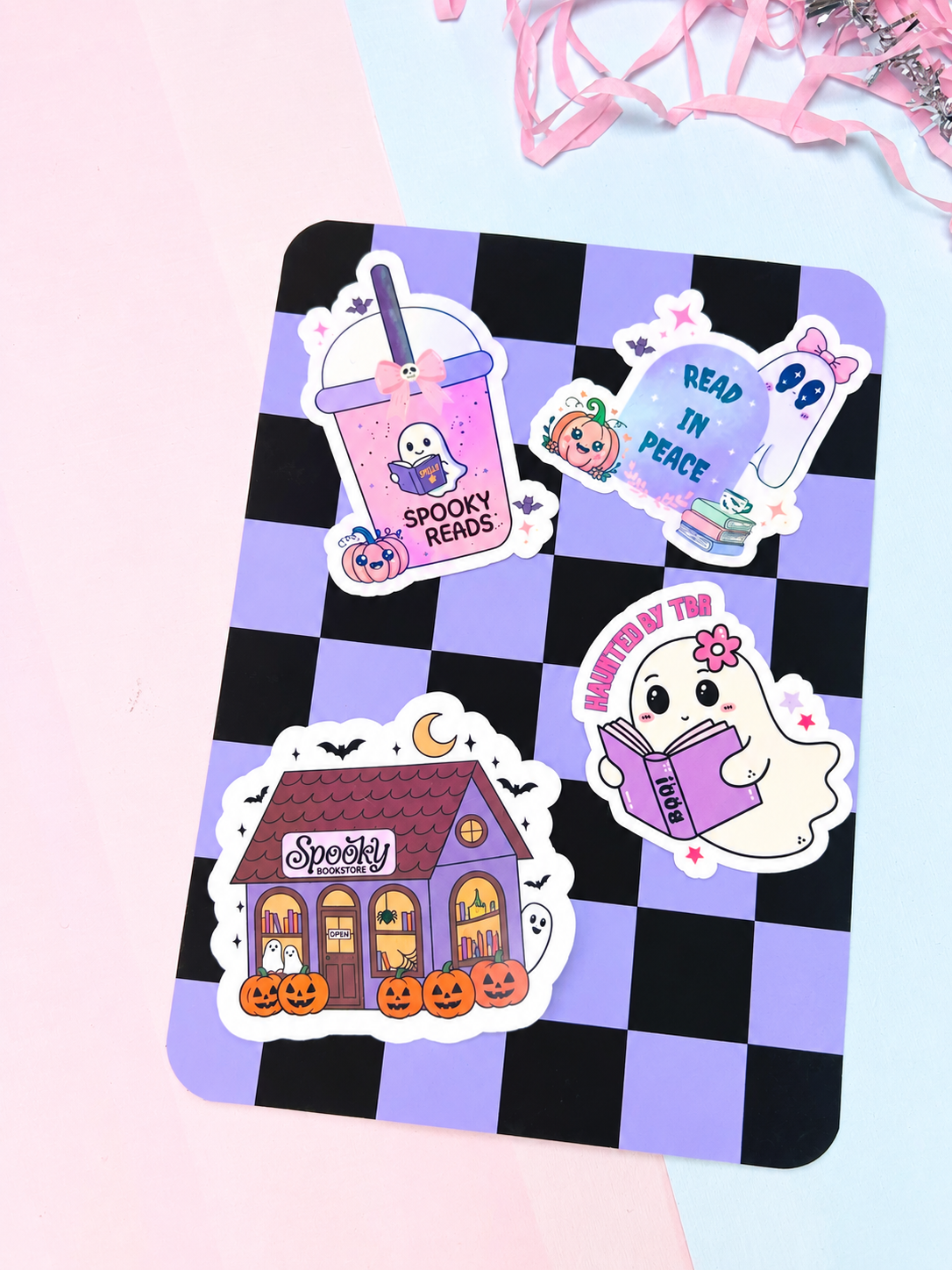Halloween ebook insert with black-and-purple checkerboard, peace sign and haunted house stickers