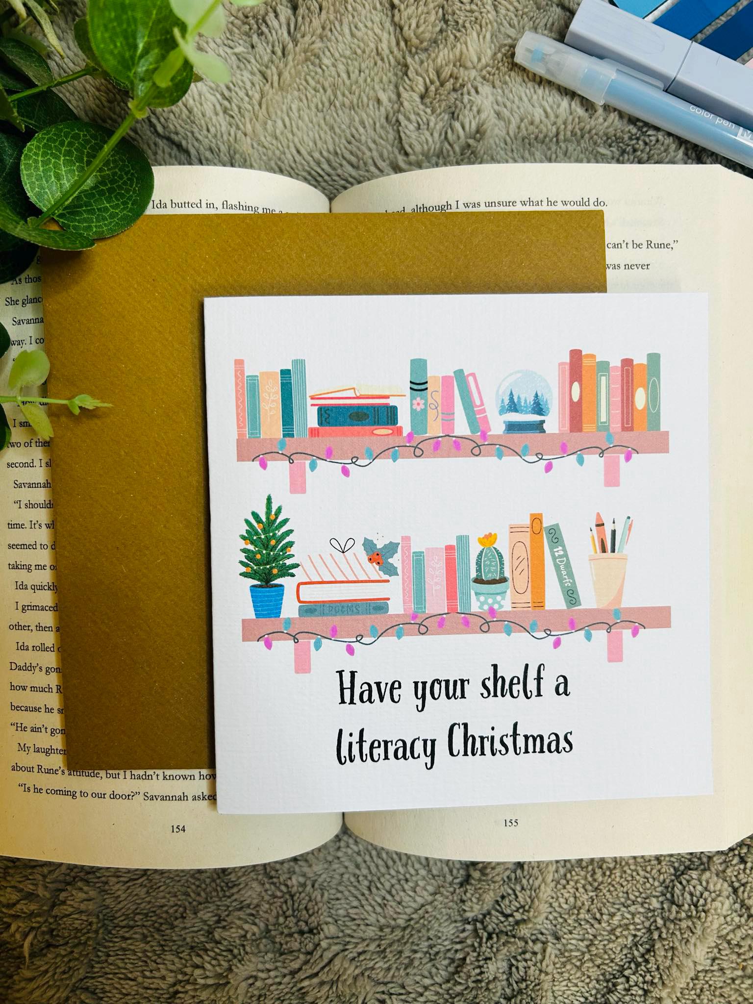 Literary Christmas shelf card featuring festive bookish holiday design, perfect Christmas card for readers and book lovers.