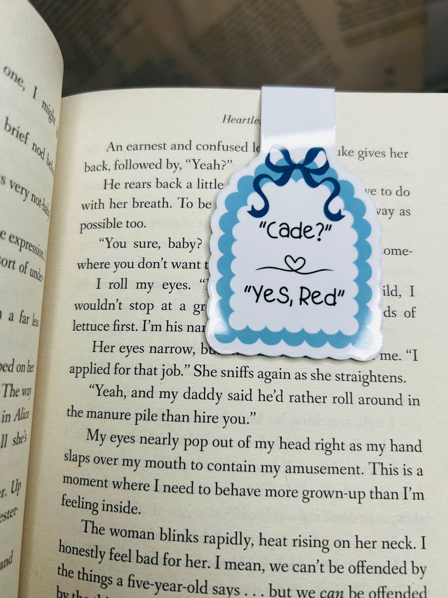 "Magnetic bookmark featuring the quote 'Cade? Yes, Red' in a blue scalloped design,