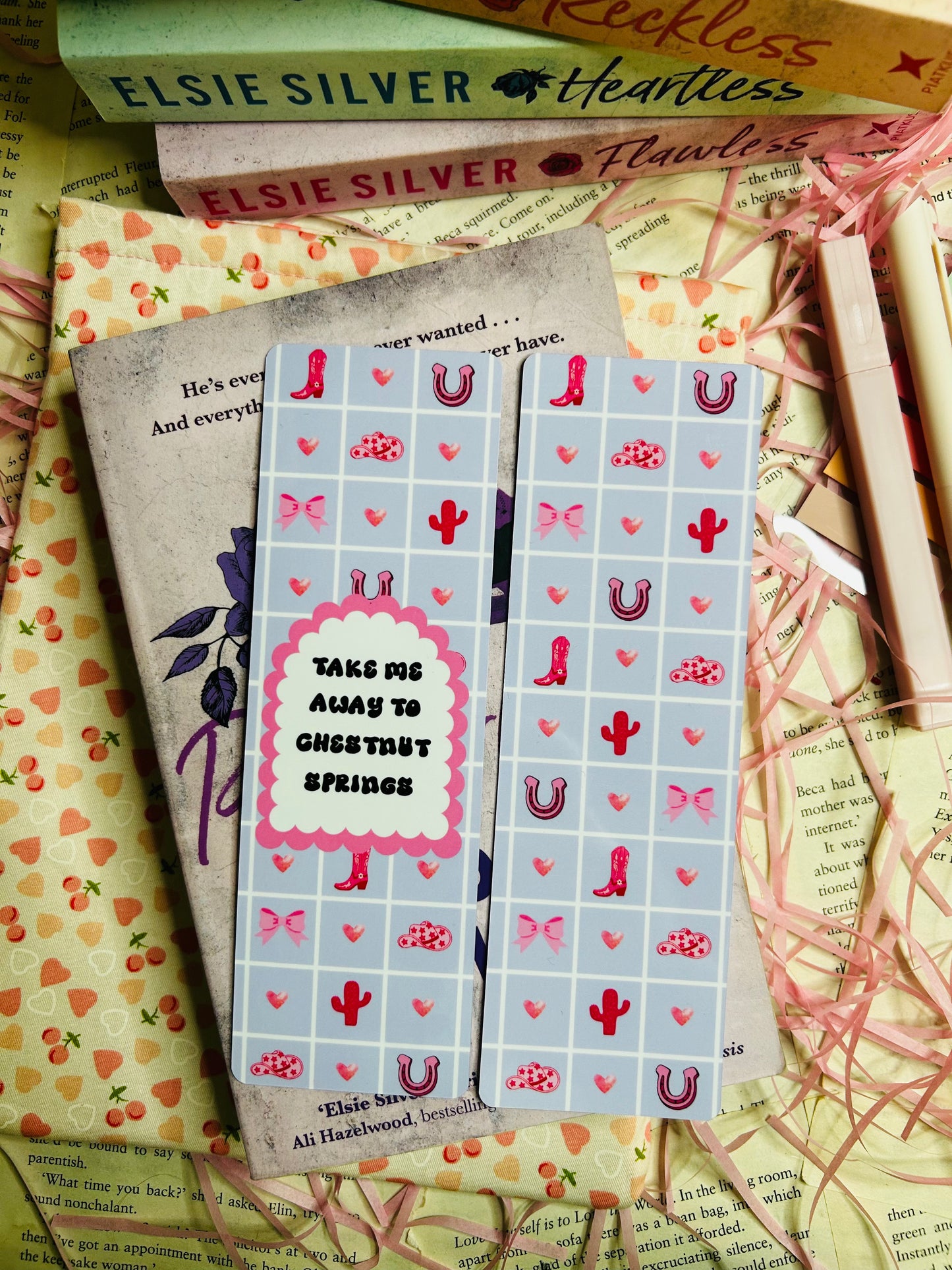 'Take Me Away to Chestnut Springs,' with pastel blue backgrounds decorated with cowboy boots, hearts, bows, cacti, and horseshoes.