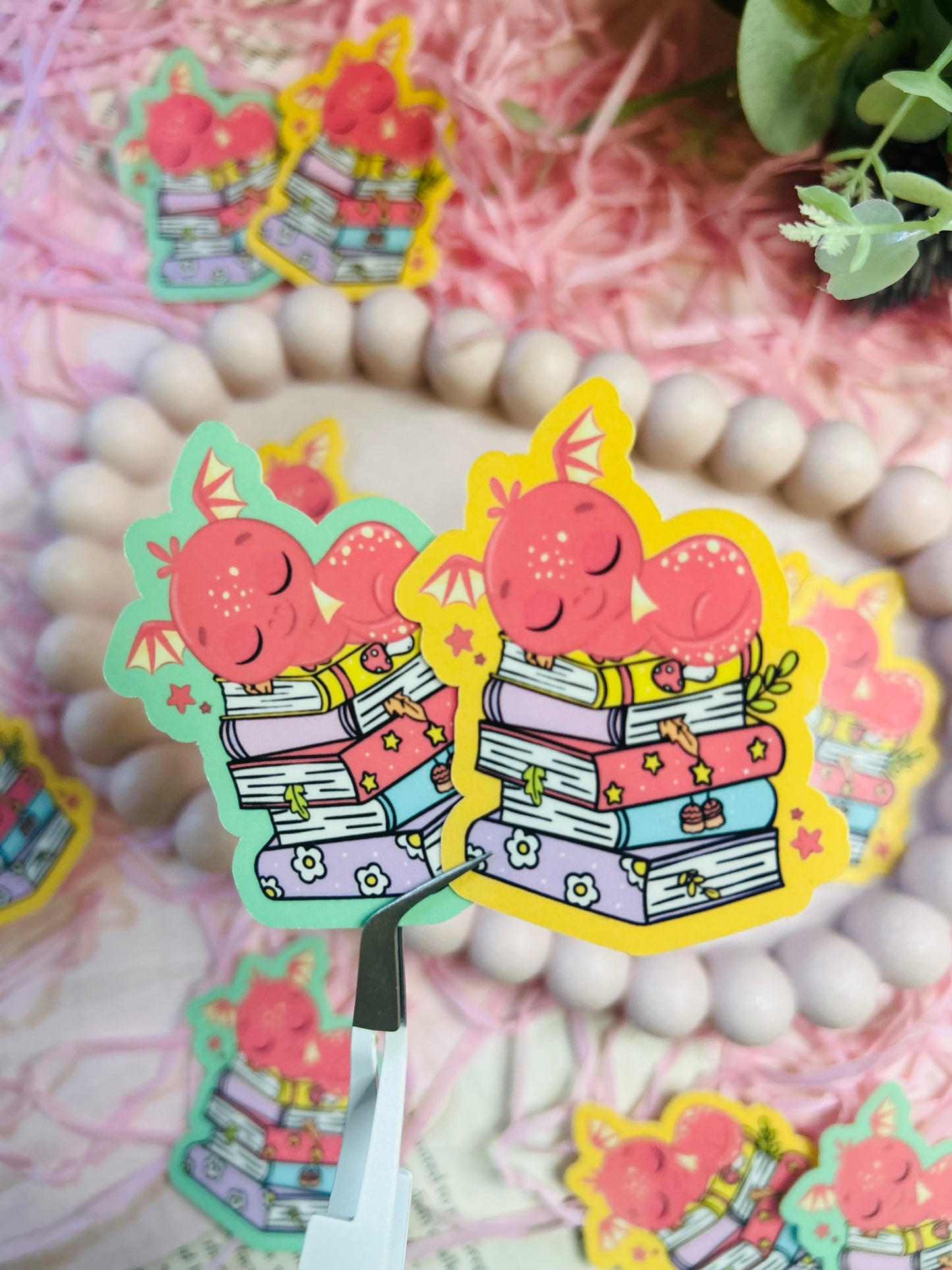 Red Dragon bookish stickers! Perfect for fantasy book lovers, this sticker features a charming red dragon perched on a stack of books.