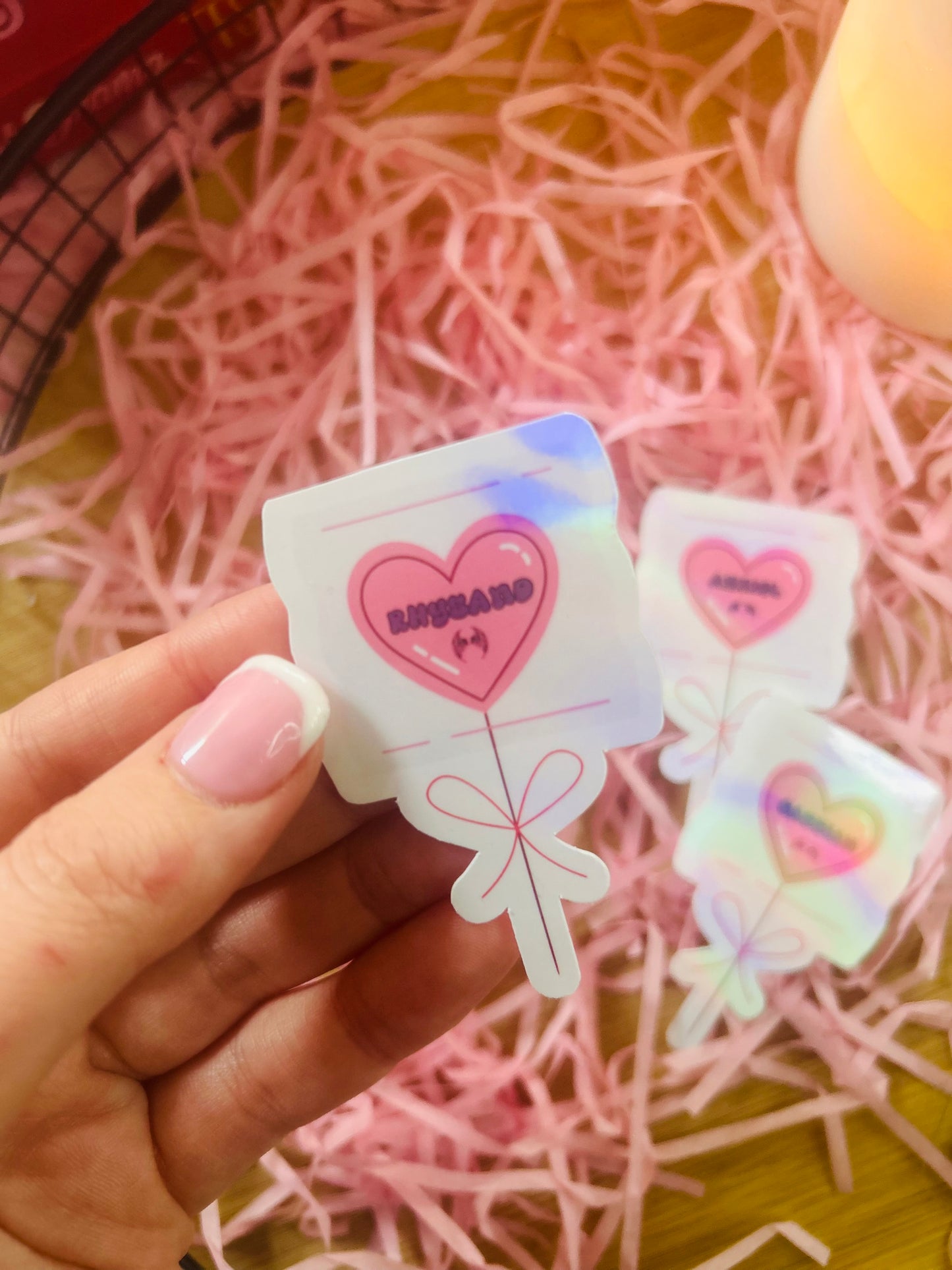 Holographic ACOTAR candy heart balloon stickers featuring Rhysand, Cassian, and Azriel. Perfect bookish merch for fantasy lovers, ideal for decorating laptops, water bottles, and journals.