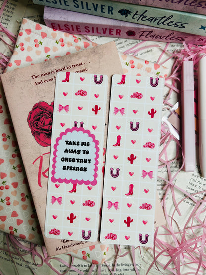  'Take Me Away to Chestnut Springs,' adorned with pink and red motifs of cowboy boots, hearts, bows, cacti, and horseshoes