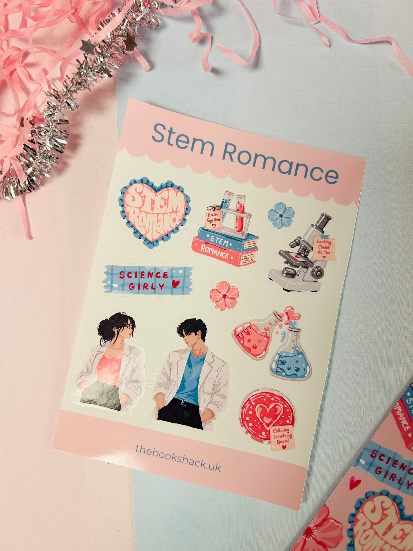 Romance sticker sheet with scientist couple, microscope, hearts, beakers, and flowers