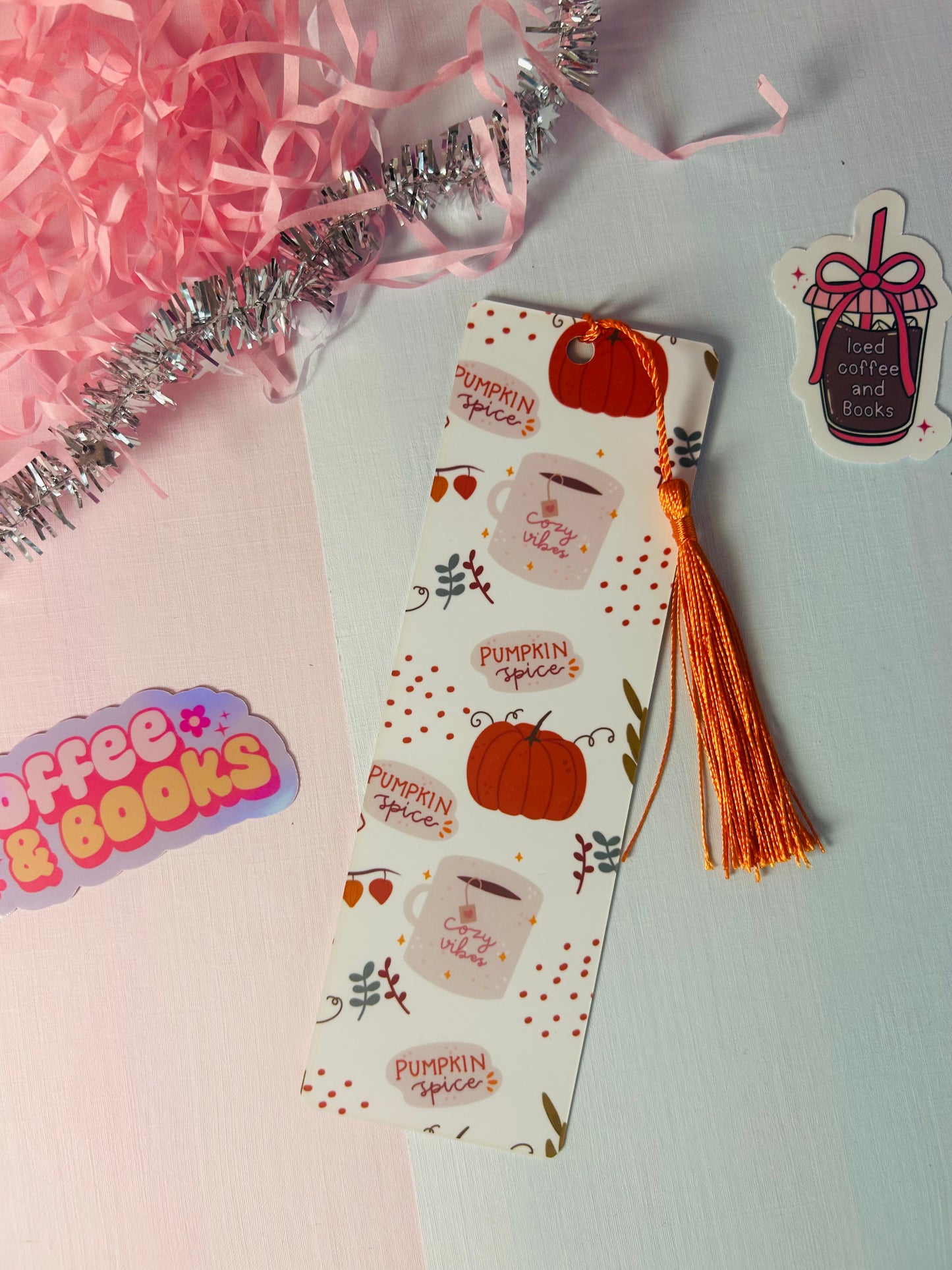Autumn pumpkin spice paper bookmark with orange tassel and coffee cup pattern