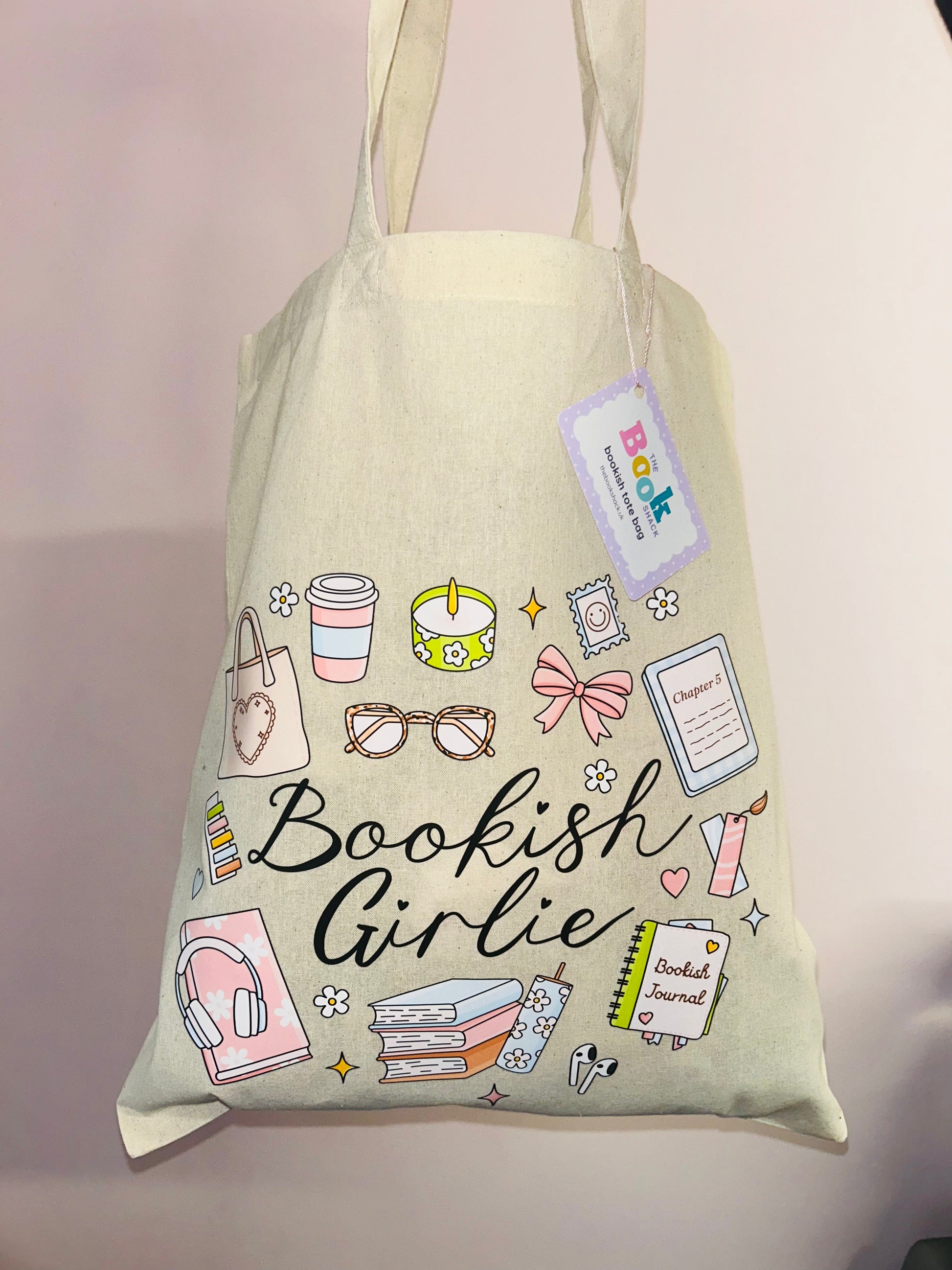 Cotton tote bag with 'Bookish Girlie' graphic, hanging tag, books and stationery icons