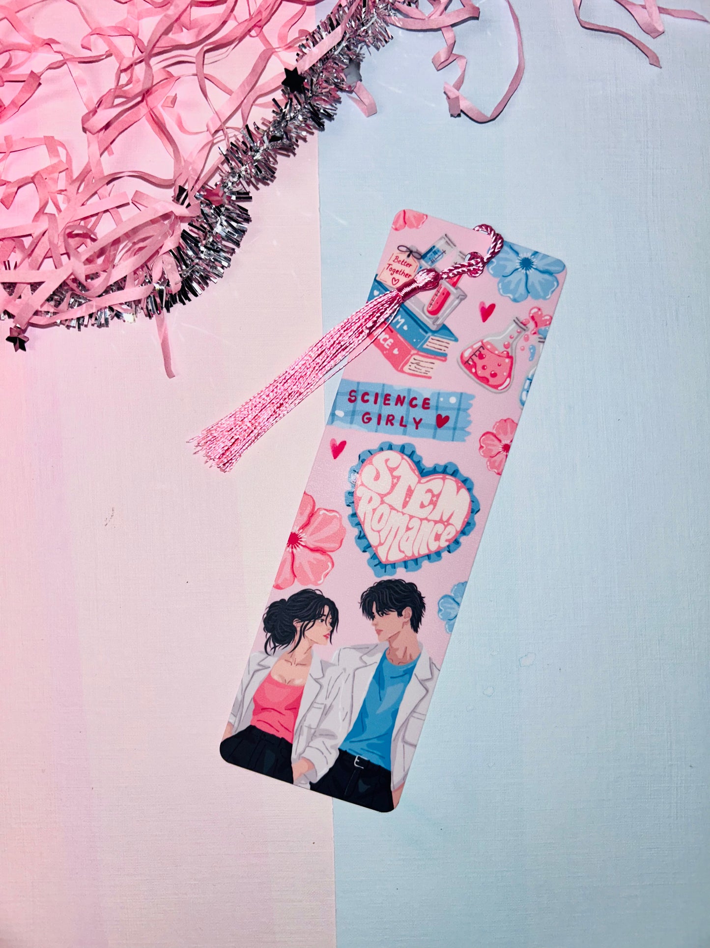 Pink science-themed romance bookmark with tassel and heart bow top