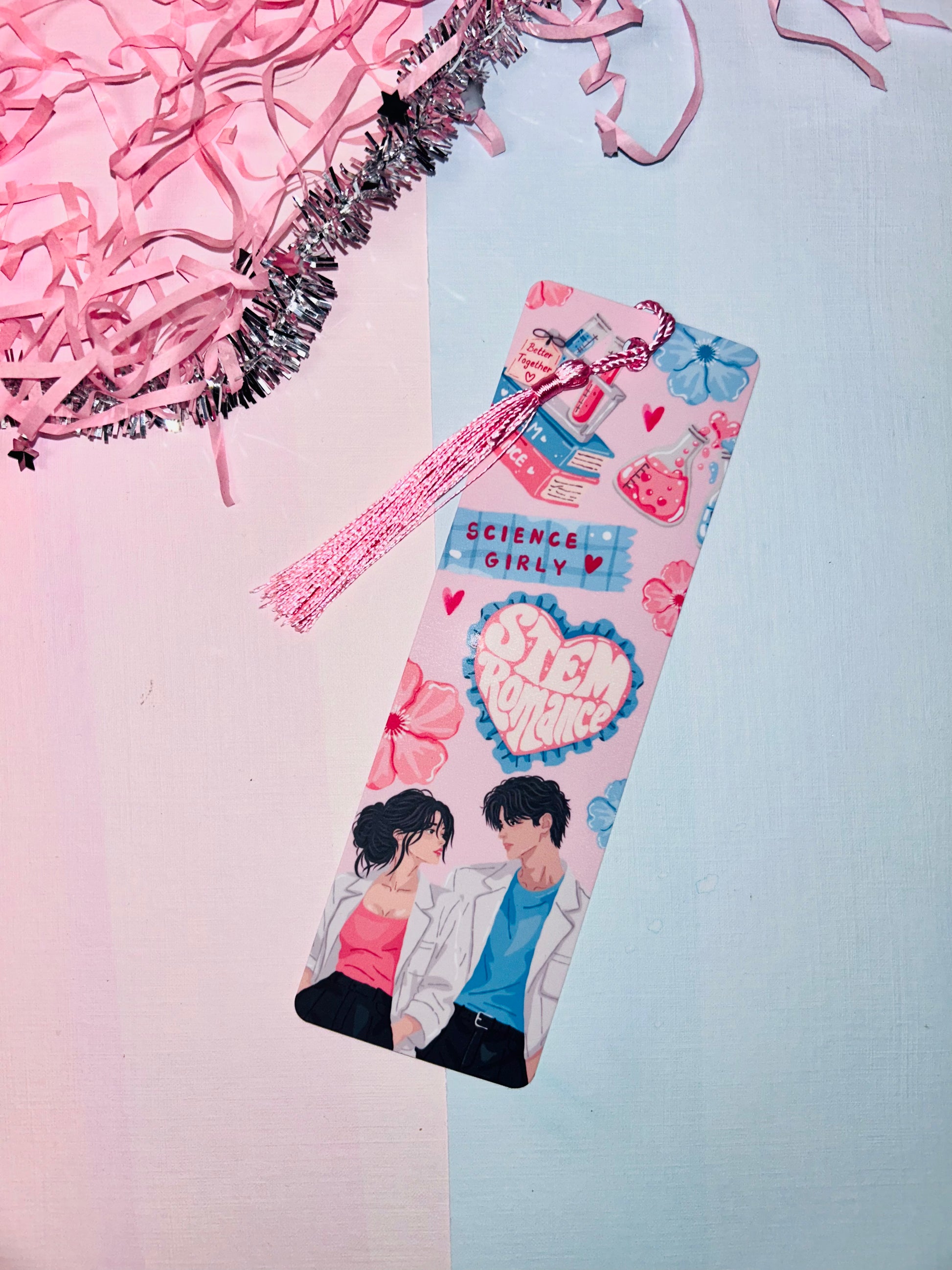 Pink science-themed romance bookmark with tassel and heart bow top