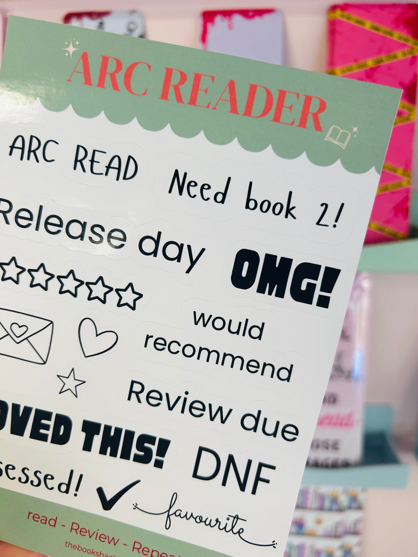 ARC Reader sticker sheet close-up with ARC READ, Need book 2!, OMG!, and review text