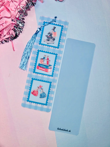 STEM romance postage stamp bookmark with blue tassel and three bottle-and-lab stamp designs
