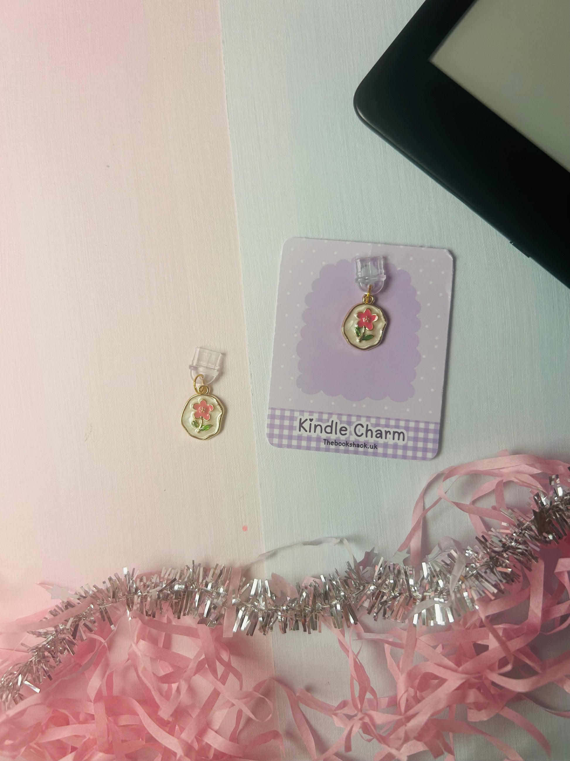 Gold flower Kindle USB-C dust plug charm on lavender card with pink ribbon