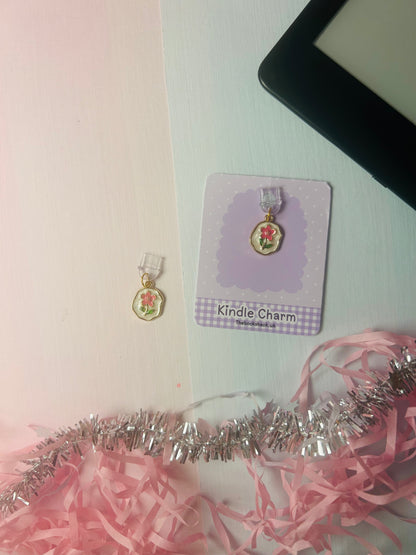 Gold flower Kindle USB-C dust plug charm on lavender card with pink ribbon