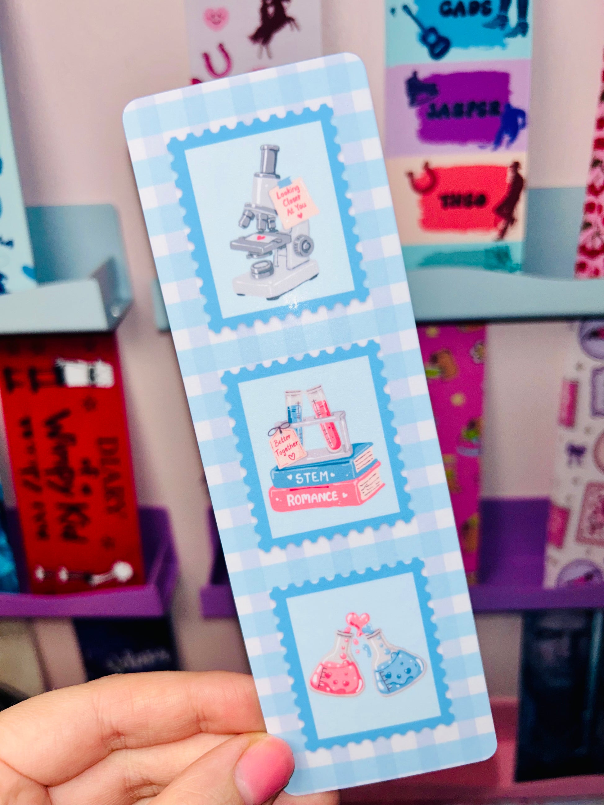 STEM romance postage stamp bookmark showing three stamp-style lab and potion illustrations