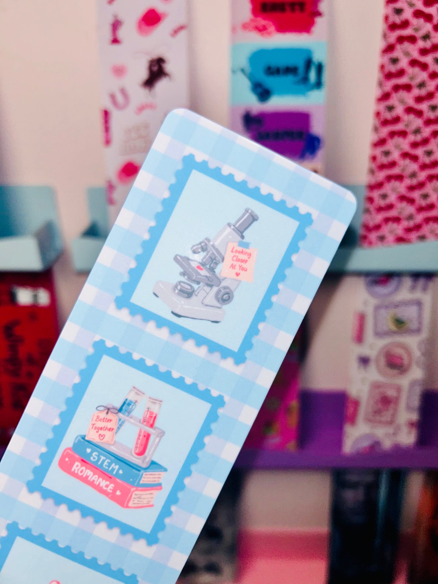 STEM romance postage stamp bookmark with three science stamp panels in light blue