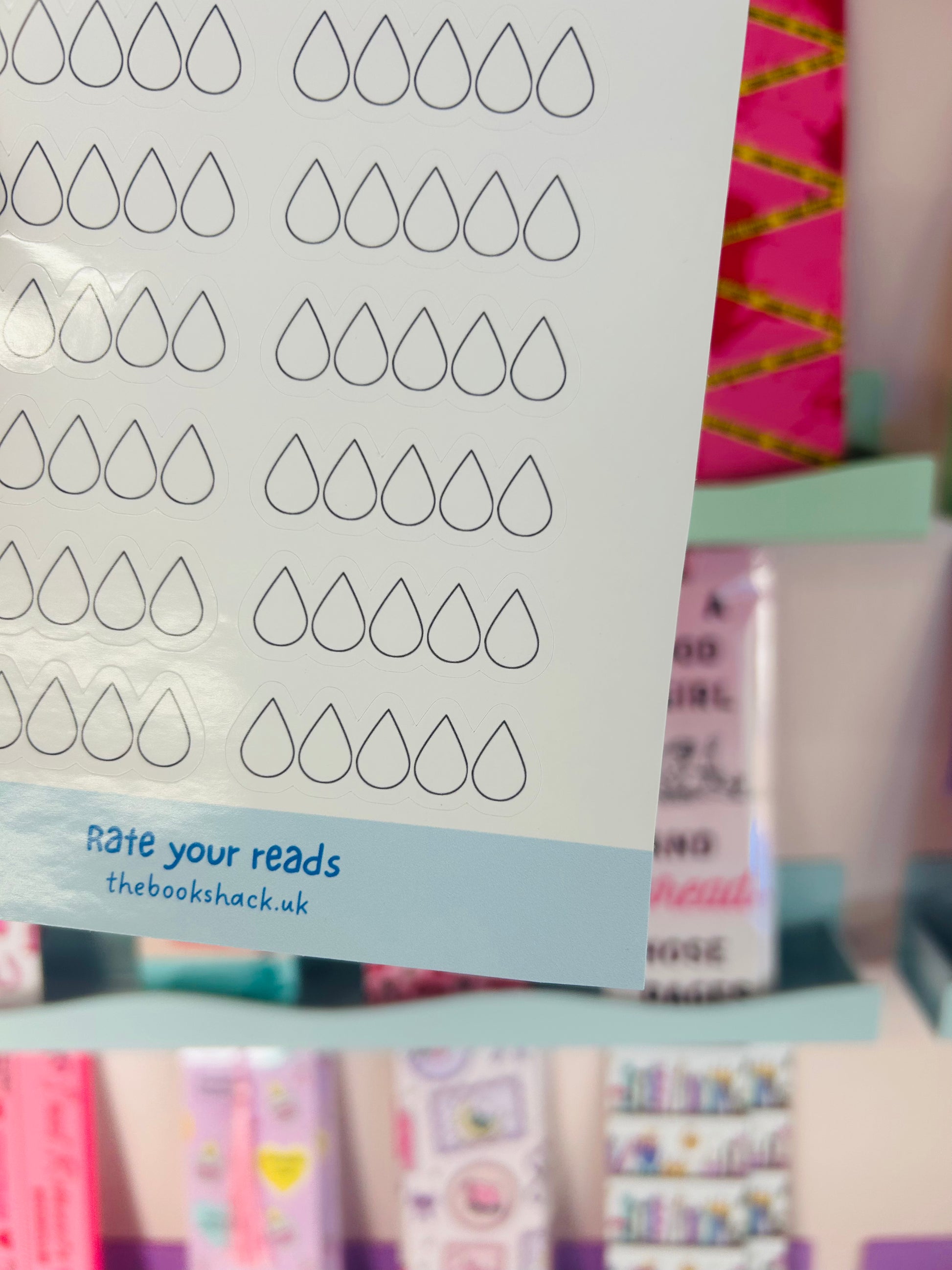 Close-up of sticker sheet rows of tear-drop rating icons with “rate your reads” text