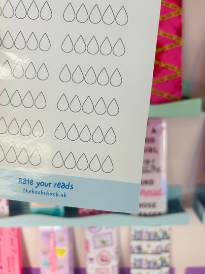 Close-up of sticker sheet rows of tear-drop rating icons with “rate your reads” text