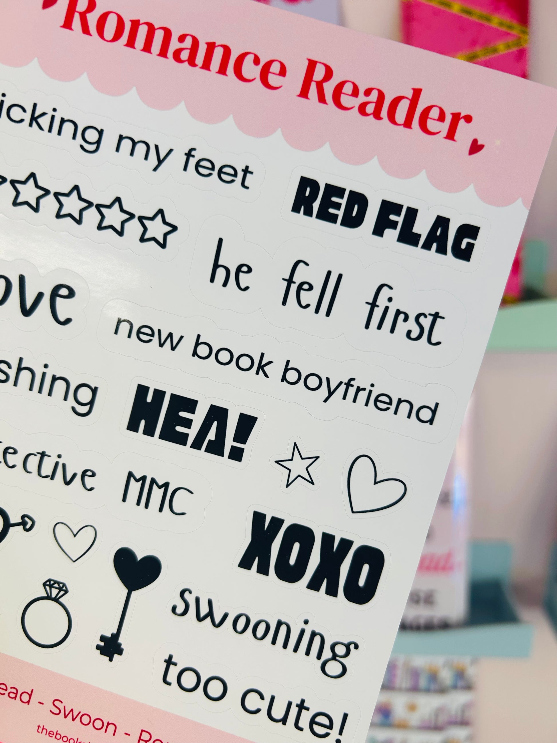 Close-up sticker sheet showing Romance Reader title, RED FLAG, HEA!, hearts, and stars