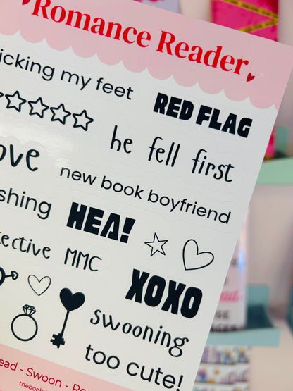 Close-up sticker sheet showing Romance Reader title, RED FLAG, HEA!, hearts, and stars