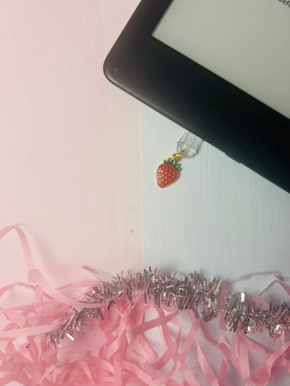 USB-C dust plug charm with gold loop and strawberry enamel pendant