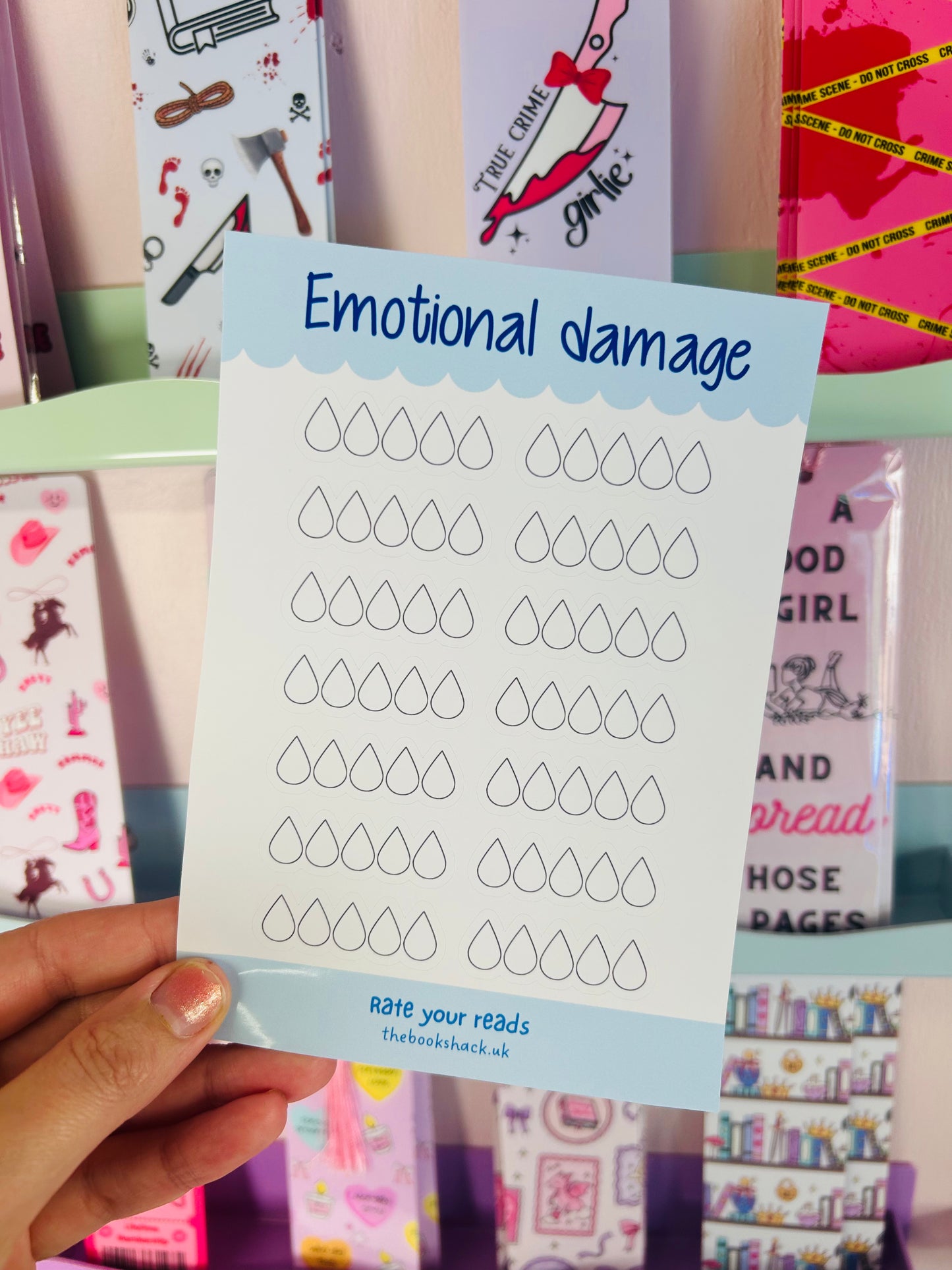 Handheld sticker sheet titled “Emotional damage” with rows of tear-drop rating icons