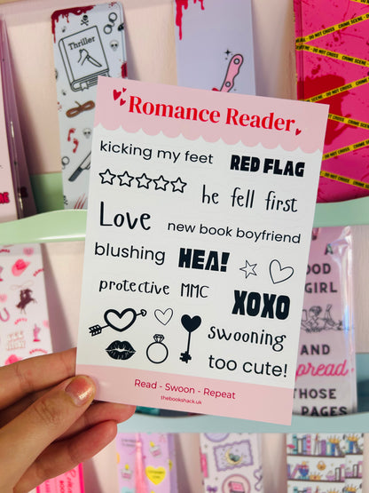 Sticker sheet held in hand with Romance Reader title, hearts, stars, and XOXO phrases