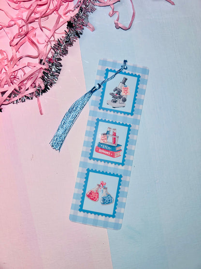 STEM romance postage stamp bookmark with blue tassel, three science-themed stamp panels