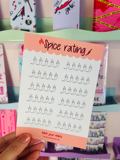 Held sticker sheet with chili pepper rating icons and orange “Spice rating” banner