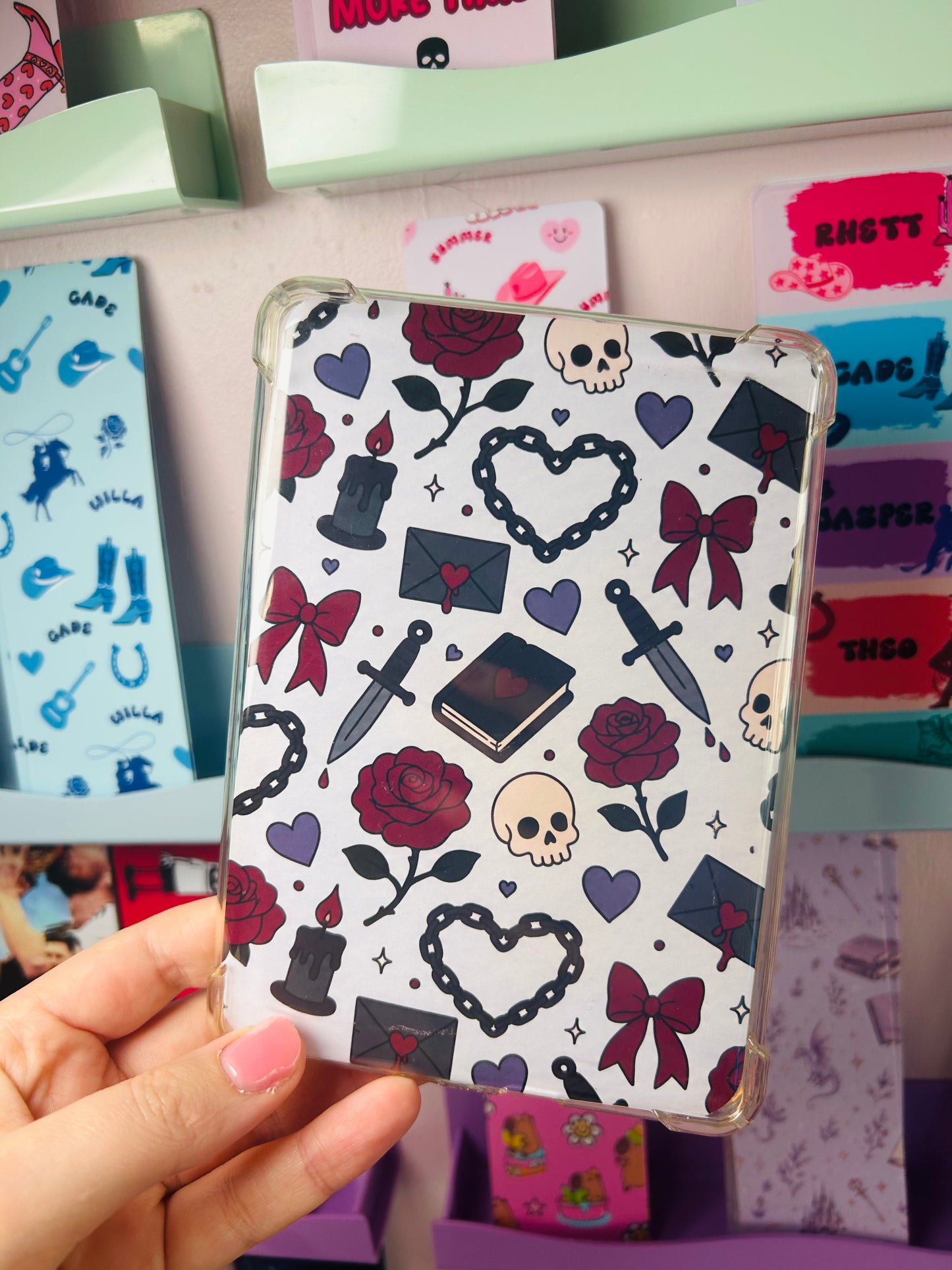 Dark romance themed Kindle insert with skull, roses, bows, and hearts pattern