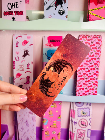 Orange glitter bookmark with face art, 'I will find you...' quote, held up