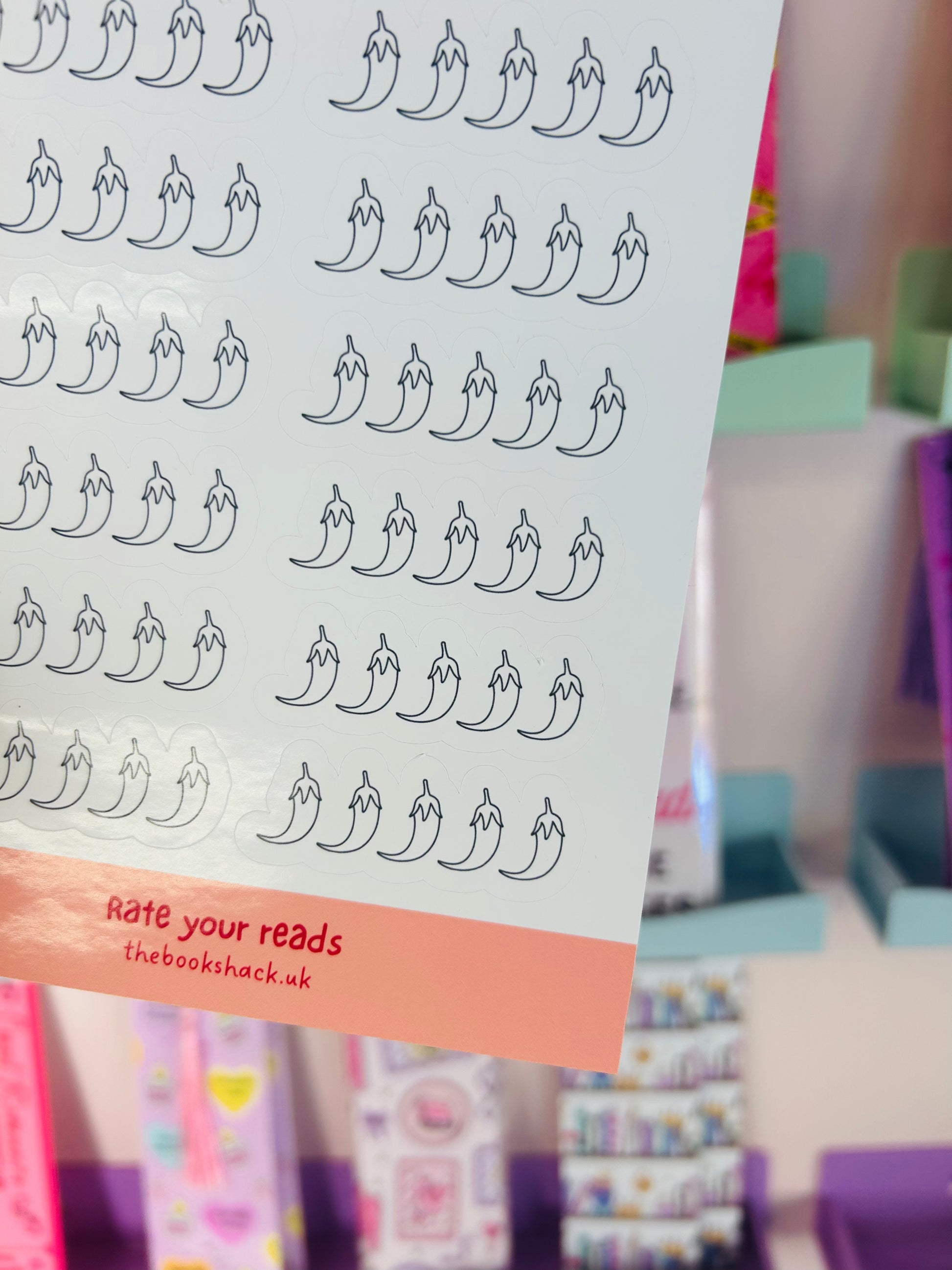 Chili pepper rating sticker sheet close-up with repeated pepper icon rows
