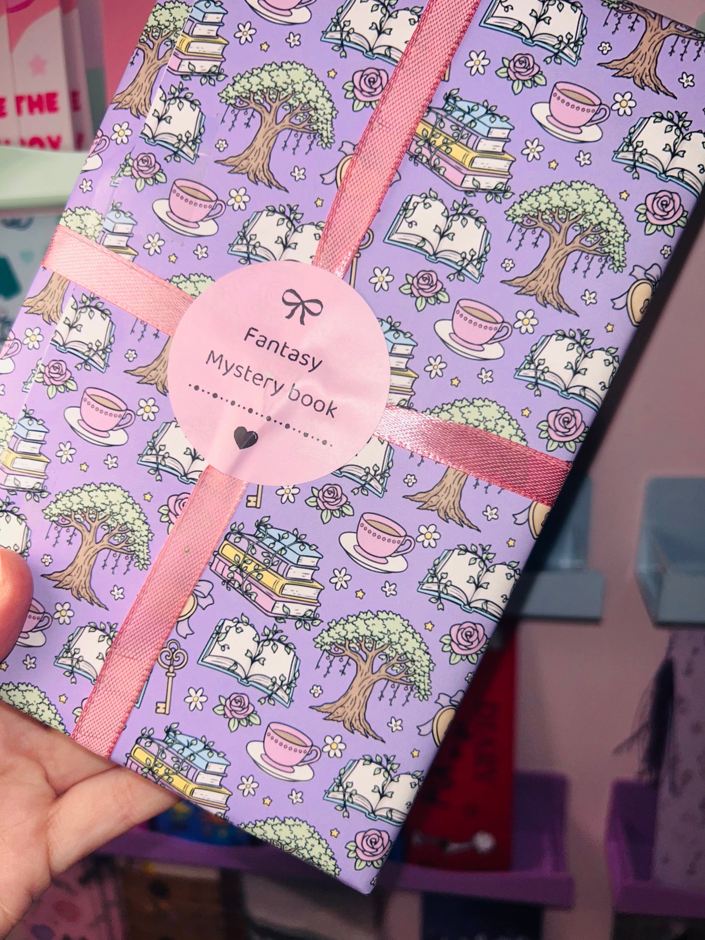 Lavender fantasy mystery book with pastel pattern and pink ribbon tie
