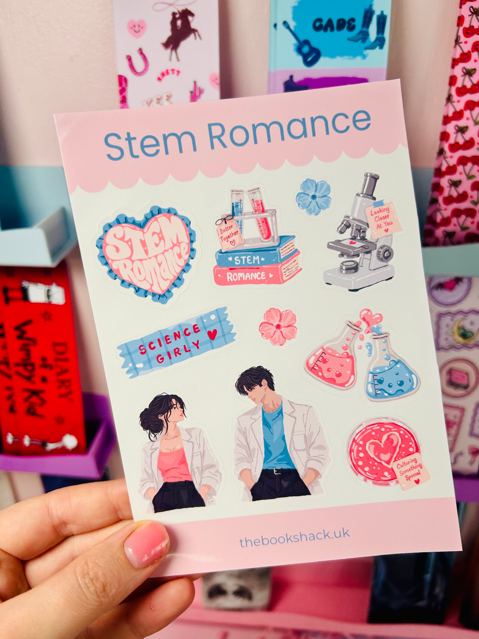 Romance sticker sheet labeled Stem Romance with microscope, beakers, hearts, and science-girly text
