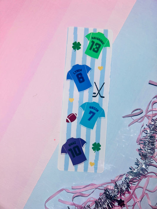 Fabric bookmark with blue jersey-style numbers and shamrock motifs