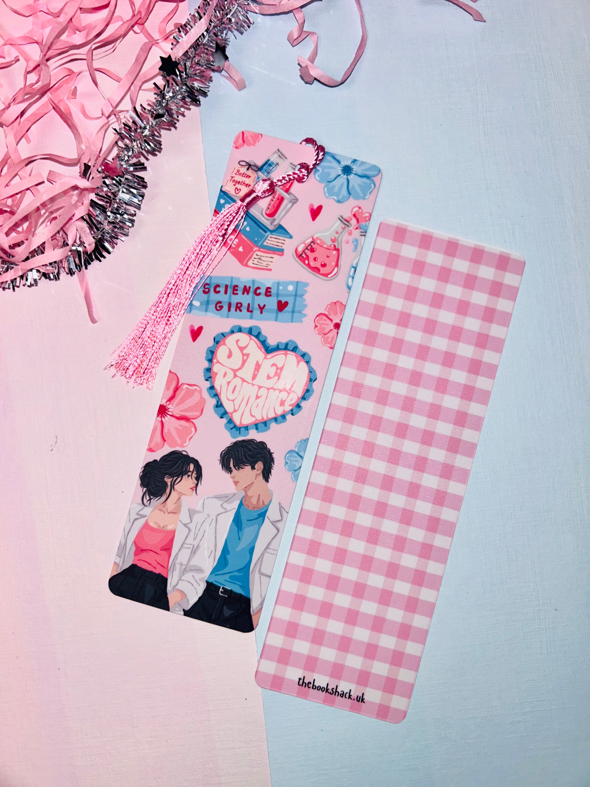 Pink science romance bookmark with tassel and heart-patterned back panel