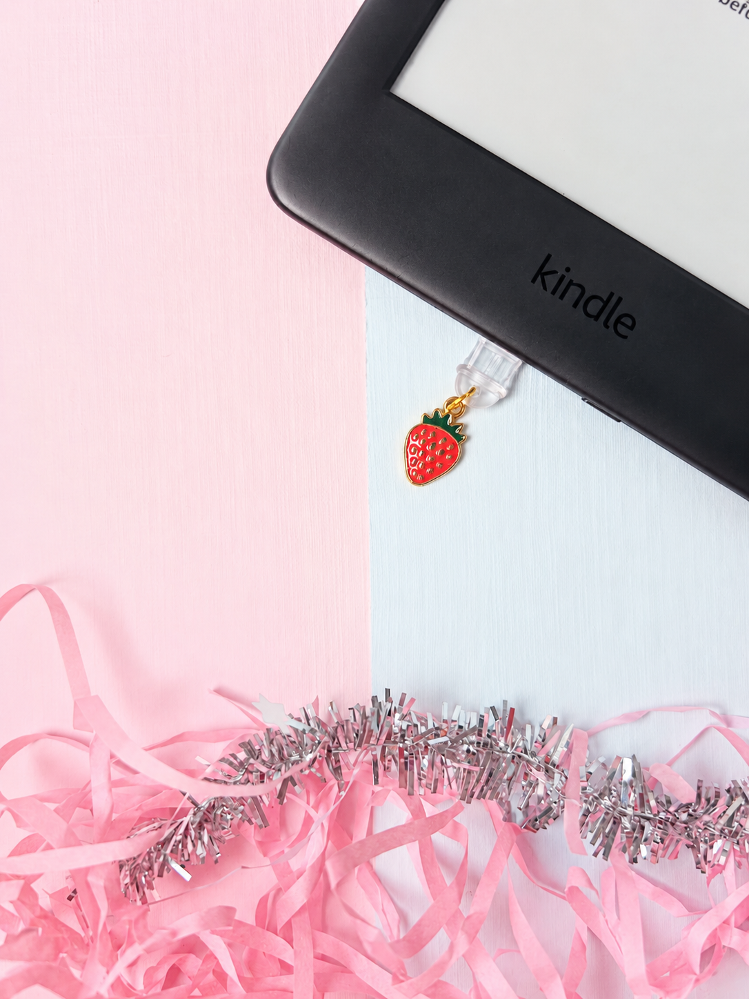 Red strawberry USB-C dust plug charm with gold top and clear connector