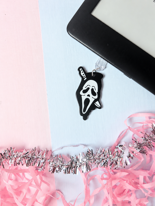 Halloween ghost mask USB-C dust plug charm with silver clasp, dangling from keyring