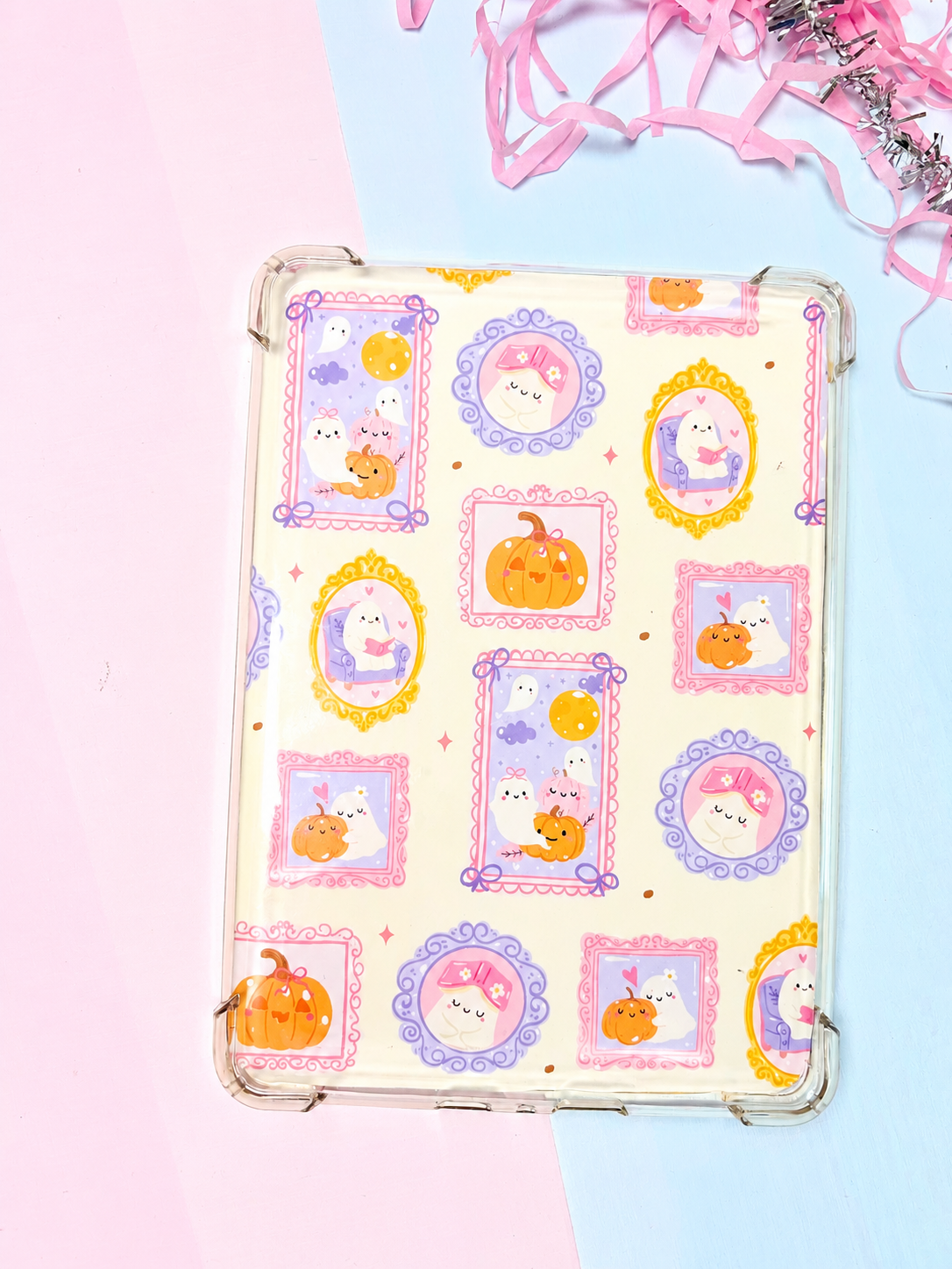 Double-sided Kindle insert with pastel Halloween character stickers in clear frame