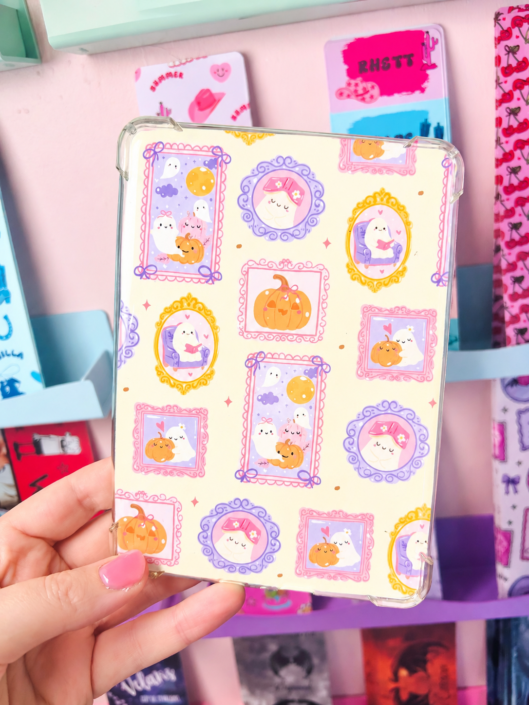 Double-sided Kindle insert in clear frame with pastel Halloween character sticker layout