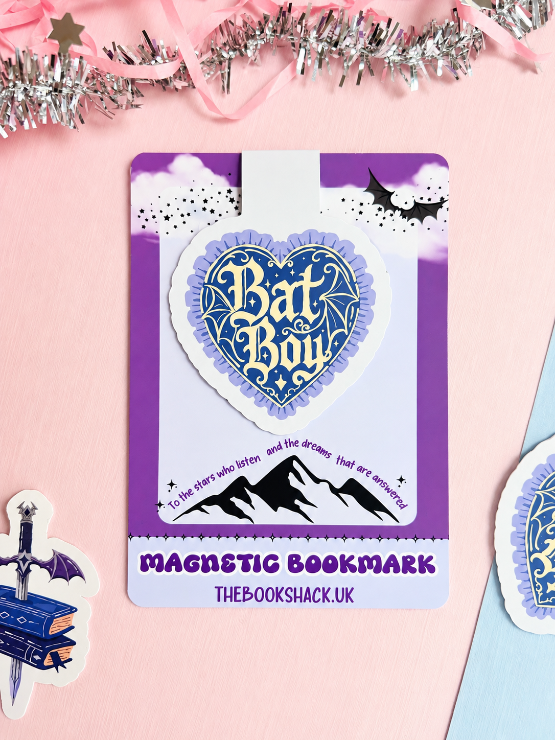 Heart-shaped blue and white magnetic bookmark card with Bat Boy logo design