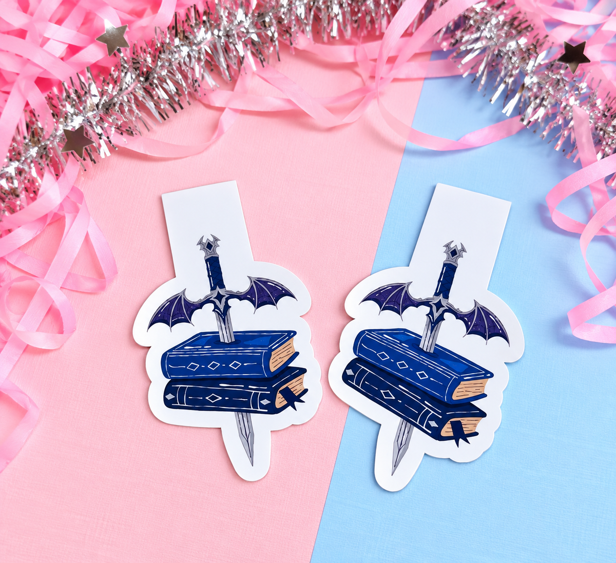 Set of two magnetic bookmarks: blue dagger over stacked books with winged cross