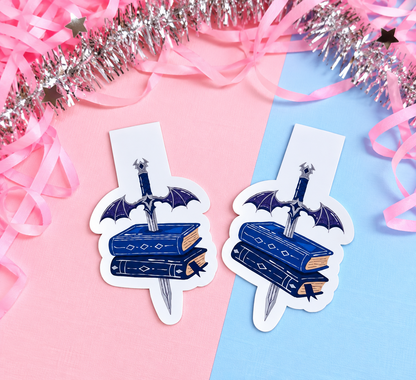 Set of two magnetic bookmarks: blue dagger over stacked books with winged cross