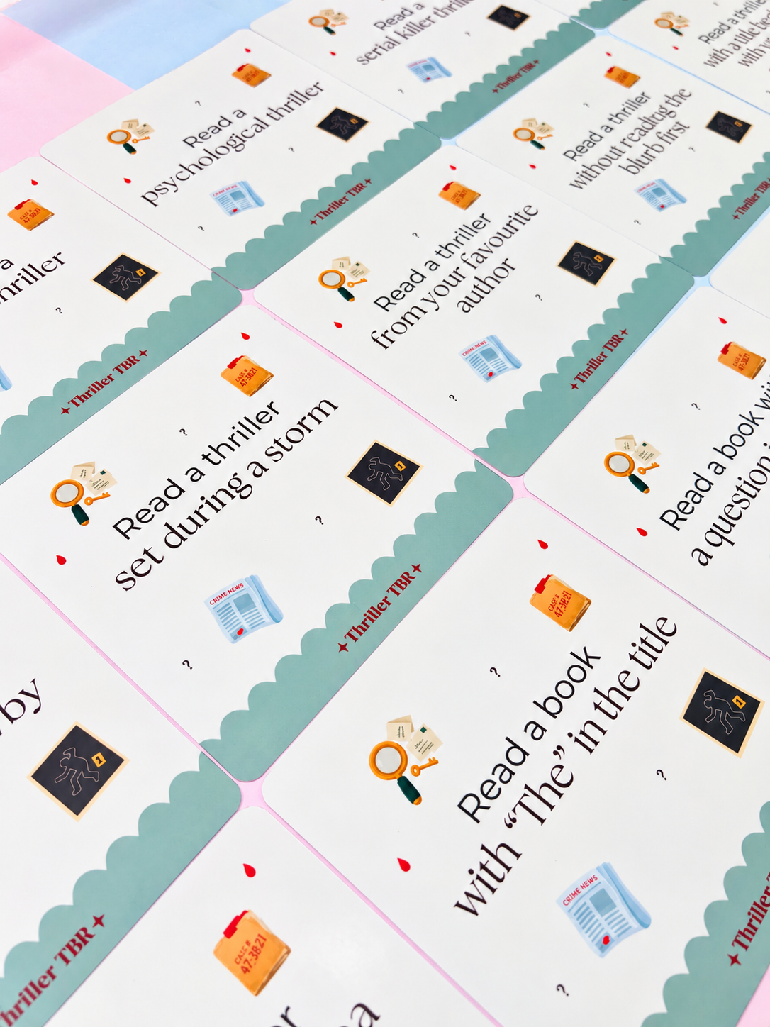 Thriller TBR reading prompt cards set with varied prompts like “Read a thriller in the dark”