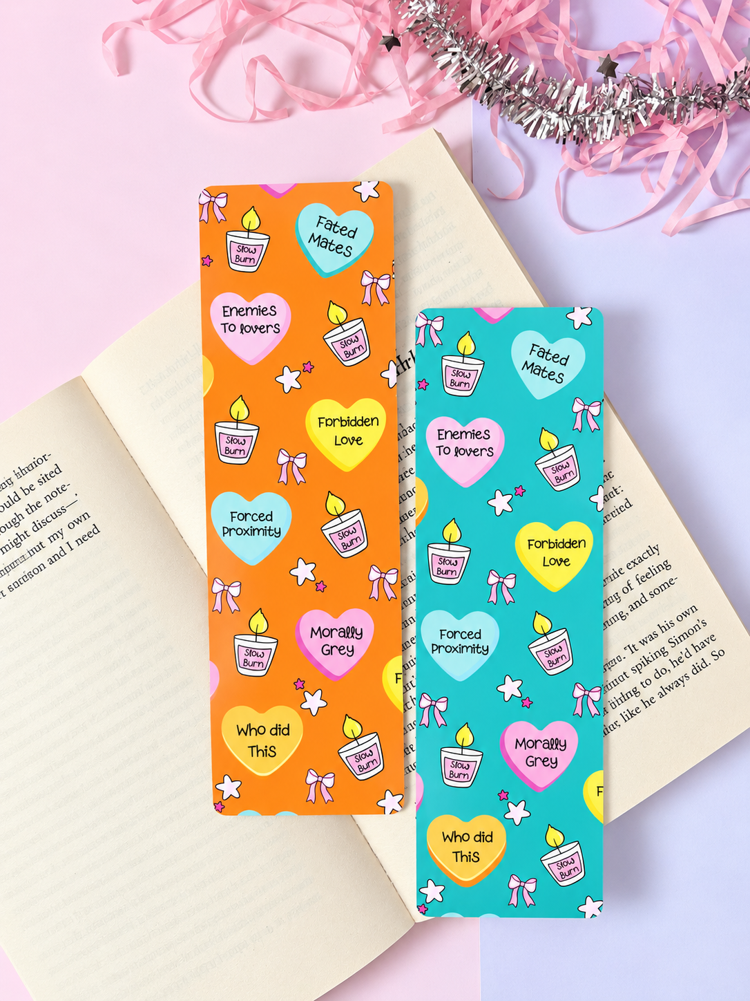 Pair of printed fantasy bookmarks with icons, orange and teal
