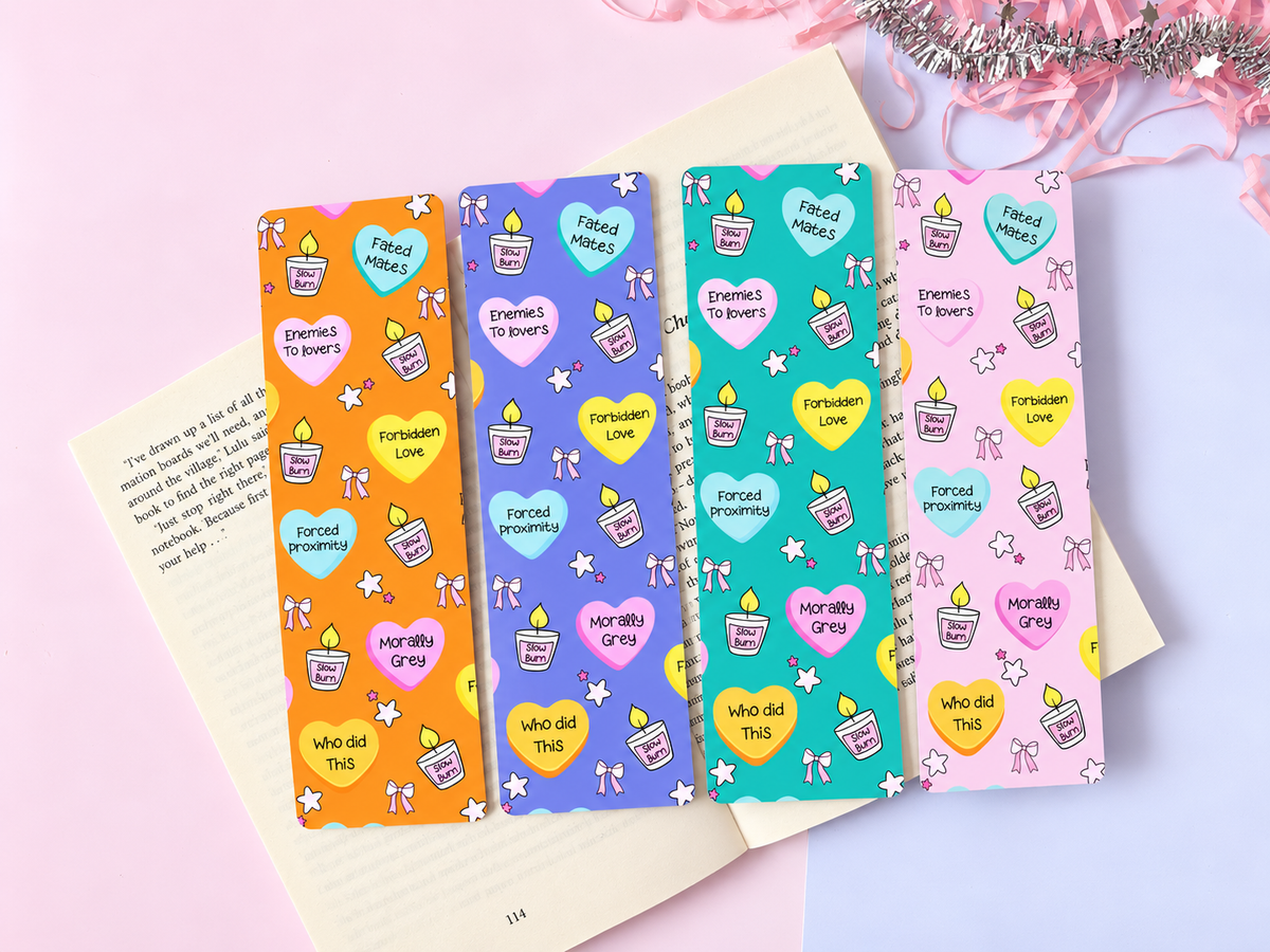 Set of four printed fantasy bookmarks with icons in orange, purple, green, teal