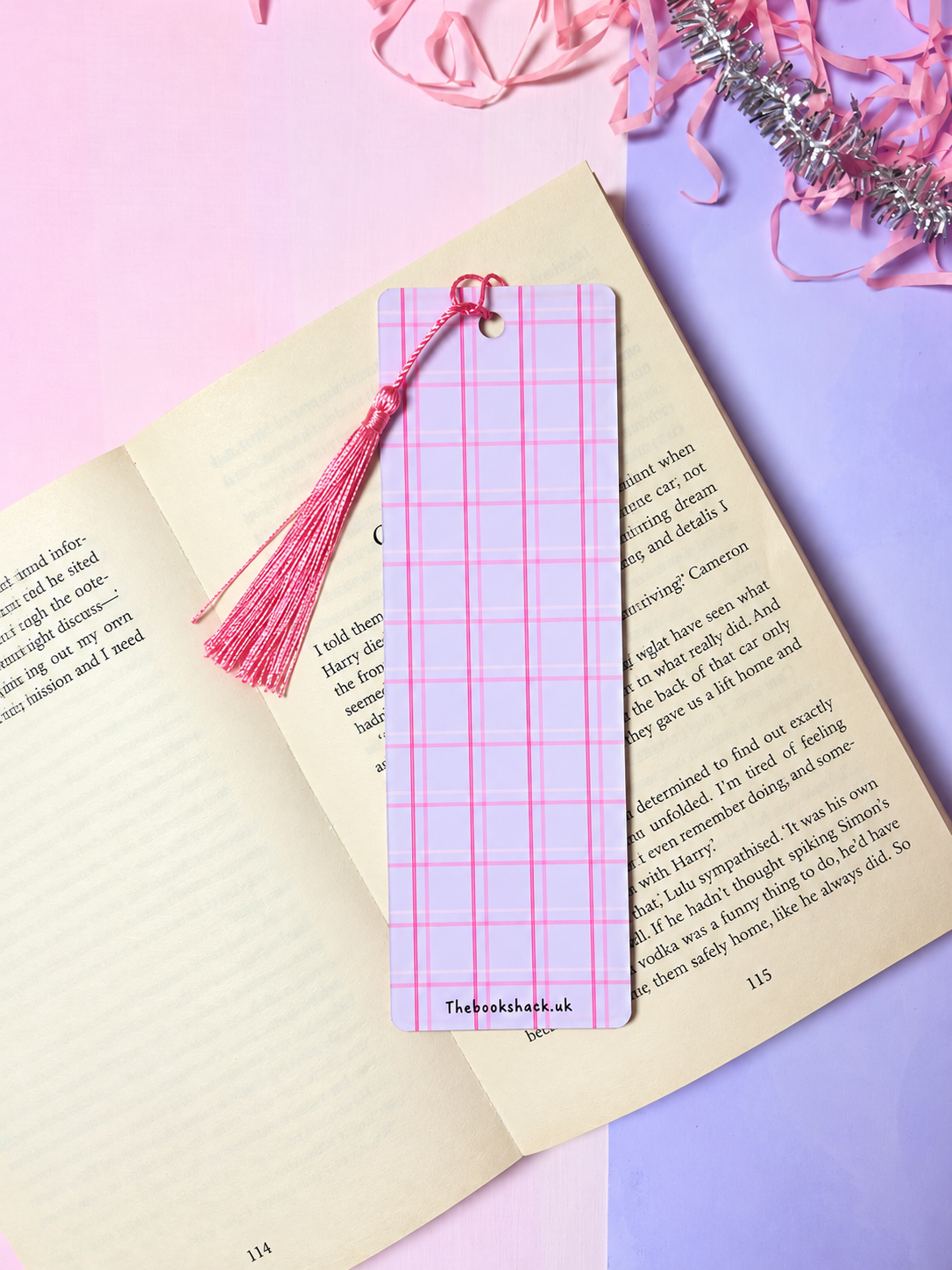 Bookmark with pink tassel and pink grid plaid design on the cover