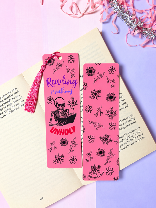 Pink skeleton bookmark with tassel and Reading something, plus floral design