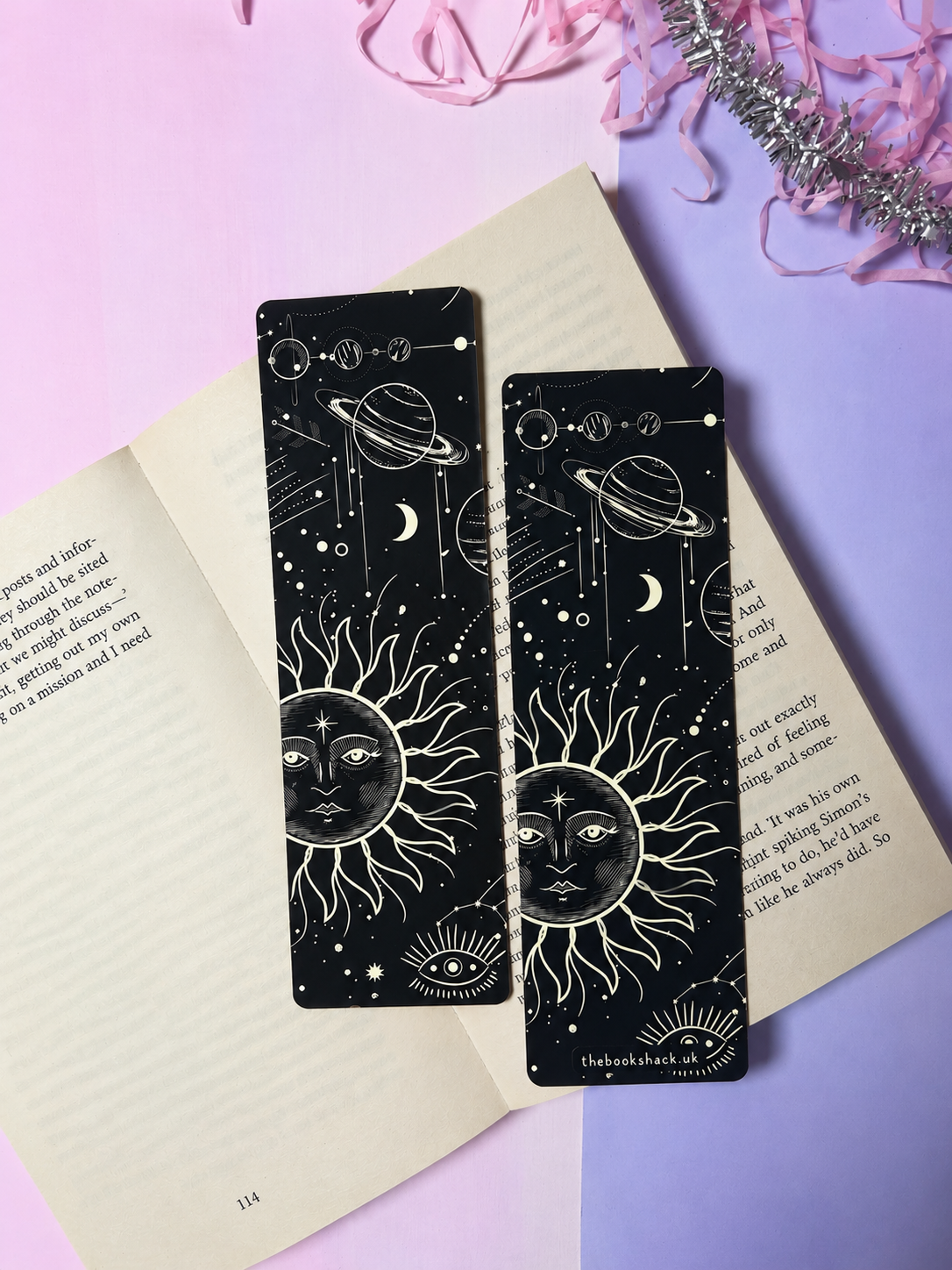 Pair of black celestial bookmarks with white sun and eye planet line art