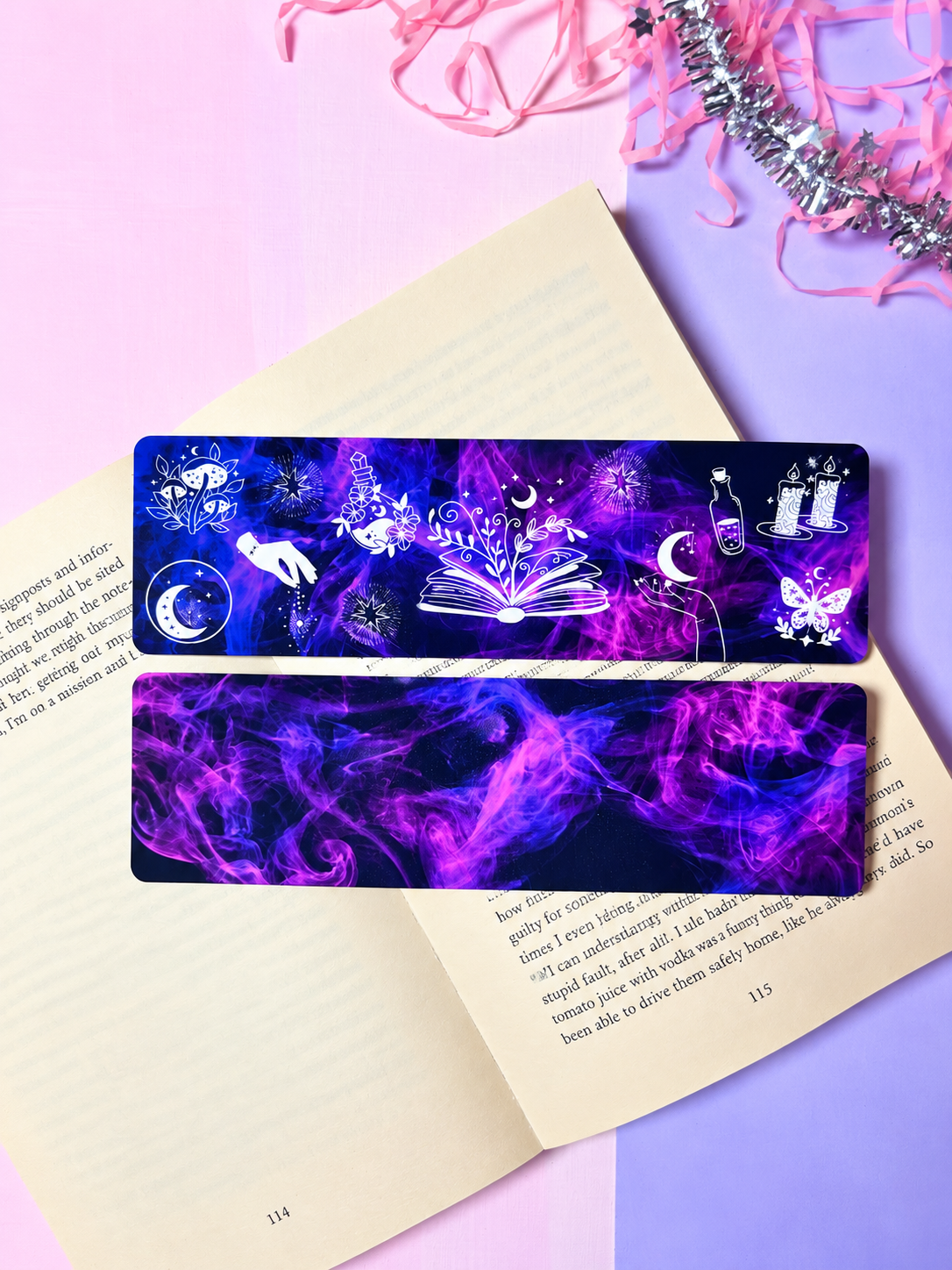 Dark purple celestial bookmark with open-book, moon, and star motifs