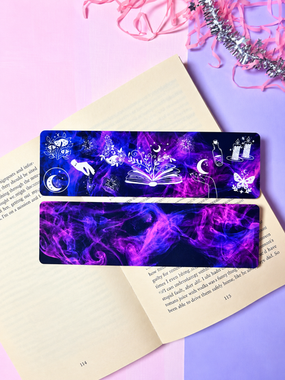 Dark purple celestial bookmark with open-book, moon, and star motifs