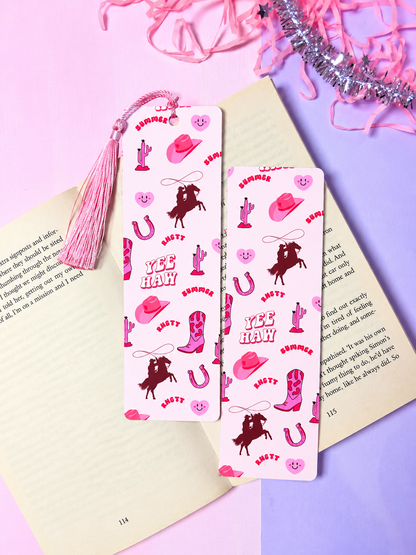 Cowboy-themed paper bookmark pair with pink patterns and tassel
